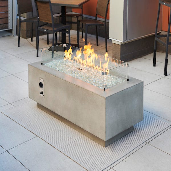 The Outdoor GreatRoom Company Natural Grey Cove 54" Linear Gas Fire Table - ships as a Propane Fire Pit and comes with a Natural Gas Conversion Kit (if needed)